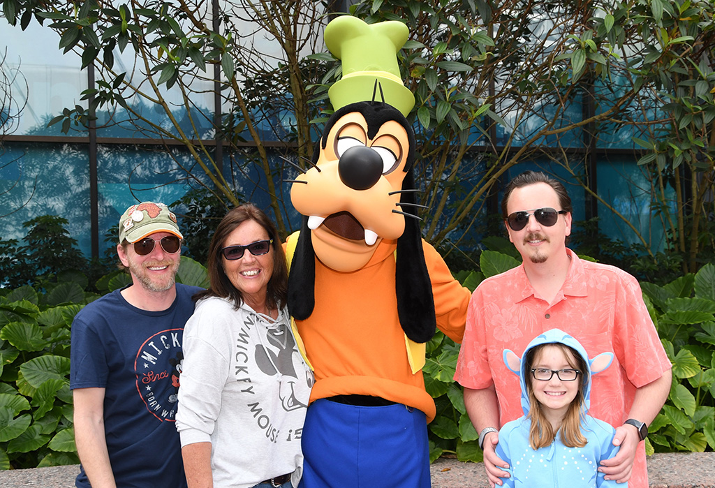 family with Goofy at Disney