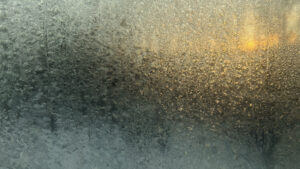 ice on storm door at sunrise