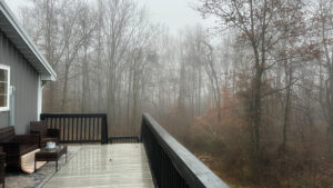 missing pillow on outside furniture in fog