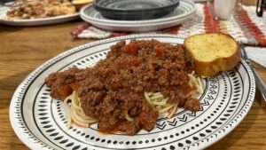 plate of spaghetti with garlic bread