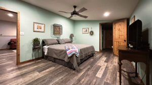 upstairs bedroom is complete with king sized bed