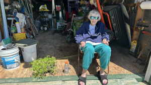 Mom sitting in the shed