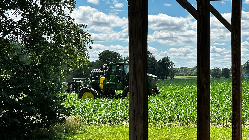 farmer spraying weeds