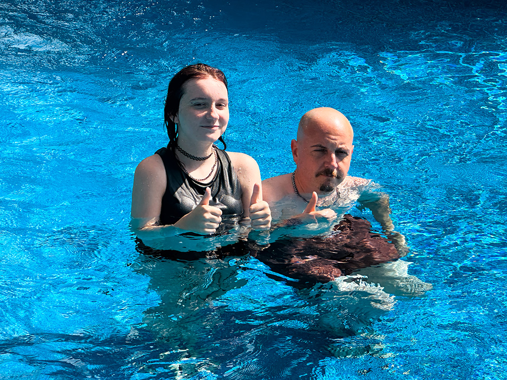 Ben and Coco in the pool