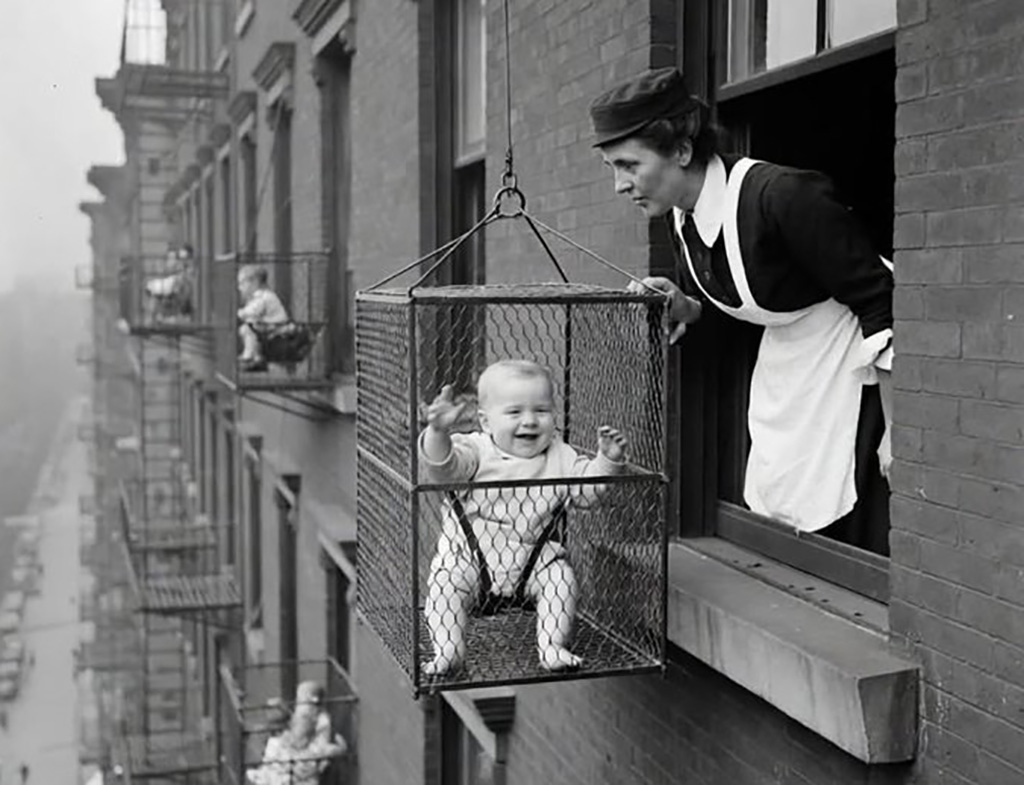 baby in a 30's health cage